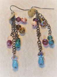 Dangles of crystal and glass add lots of color and movement to these 2 1/2" earrings.