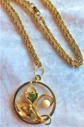 Jade, pearl and gold leaf design pendant on 25 inch serpentine chain.